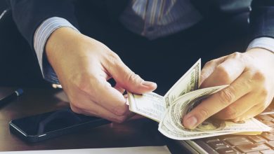 Business man counting dollar banknote - online business concept